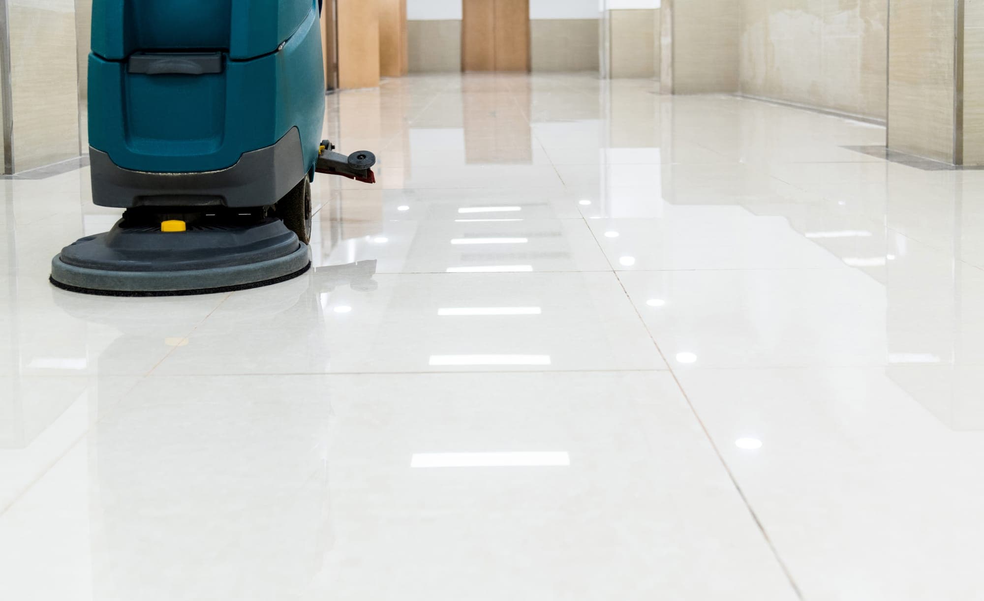 Applying a fresh coat of wax to a hard floor in North Spokane